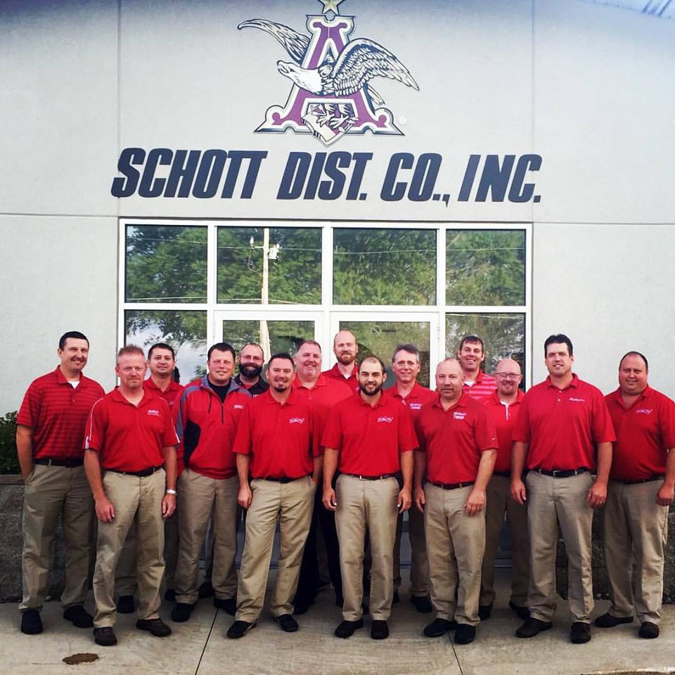 The Schott Distributing sales team in front of the Rochester office